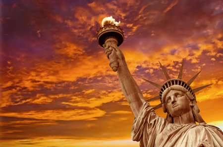 Statue of Liberty, dramatic sky background. New York City, USA