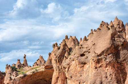 Rock formations and cave town in Zelve Valley, Cappadocia, Turkeyの写真素材