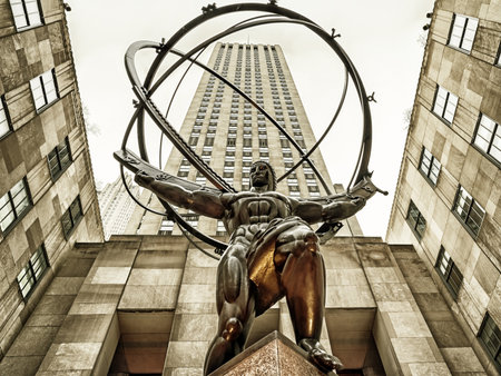 New York, USA, December 6, 2018: Atlas is a bronze statue in front of Rockefeller Center within the International Building's courtyard in Midtown Manhattan, New York City, USAのeditorial素材