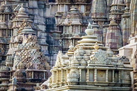 Stone carved erotic bas relief in Hindu temple in Khajuraho, India.