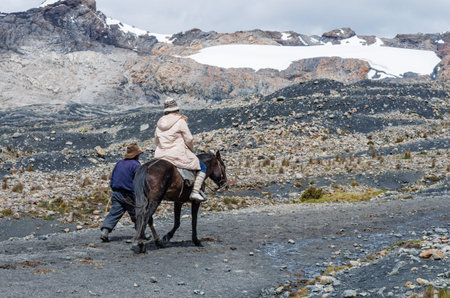 Pastoruri glacier, Peru - April 16, 2015: Tourists on horseback near Pastoruri glacier in Cordillera Blanca, Northern Peruのeditorial素材