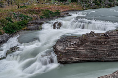 Paine Cascade (Cascada Rio Paine waterfall) in Torres Del Paine National Park in the Magallanes...