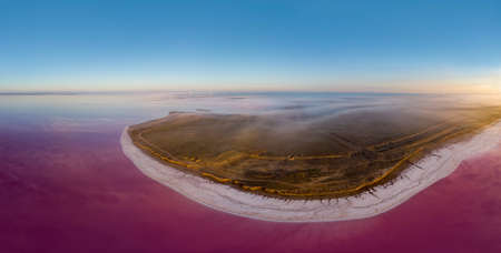Aerial view of a wind turbines at Lemurian pink salt lake, Ukraine.の写真素材