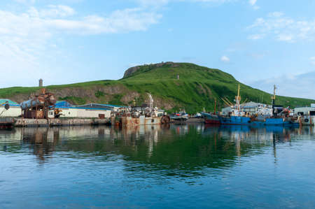 Paramushir, Russia - July 9, 2012: Panoramic view of seaport in Severo-Kurilsk, island Paramushir, Russiaの写真素材