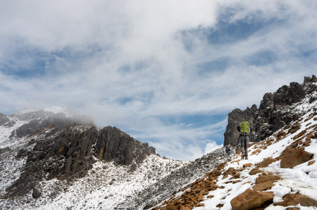Hiker trekking in the mountains. Iztaccihuatl volcano in Popocatepetl National Park, Mexico.