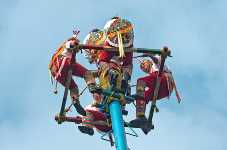 Mexico City, Mexico - November 15, 2016: Danza de los Voladores (Dance of the Flyers) - flying men performing the "voladores" ritual in Chapultepec in Mexico Cityのeditorial素材