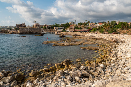 Historical houses and boats in the old port of Byblos, also known as Jbeil, a coastal town in Lebanon. One of the oldest continuously inhabited cities in the worldのeditorial素材