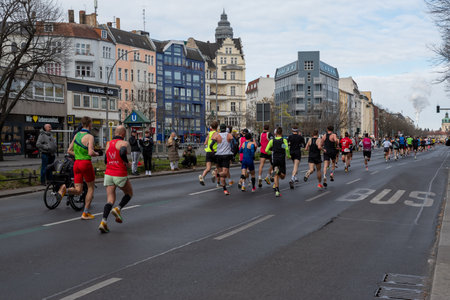Berlin, Germany, April 3, 2022: Half Marathon in Berlin. Athletes run on Otto-Suhr-Allee, Charlottenburg.のeditorial素材