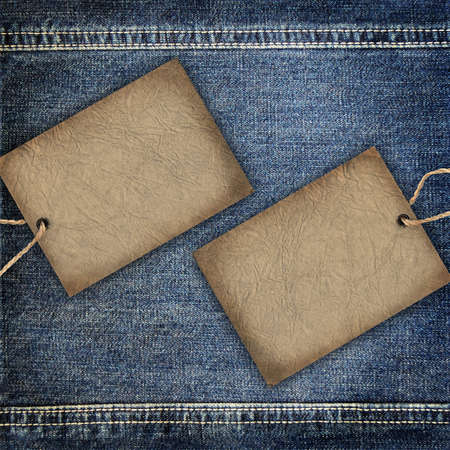 Background denim texture with cardboard labelの写真素材