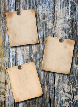 Three paper poster on a wood wallの写真素材