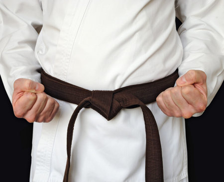 Man in a kimono and belt for martial arts