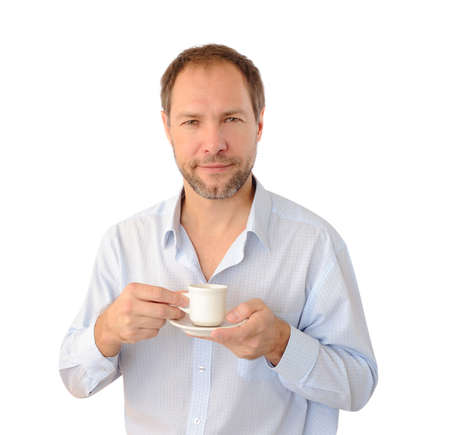 Smiling man drinking coffee isolated on white backgroundの写真素材