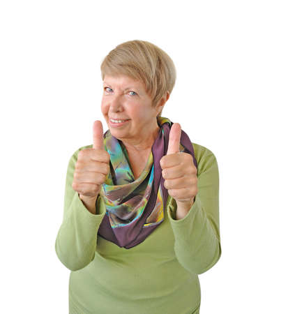 Smiling woman in green showing thumb up isolated on white backgroundの写真素材