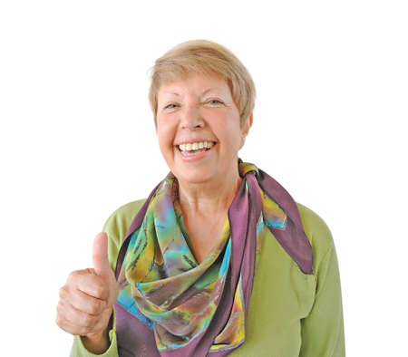 Smiling woman in green showing thumb up isolated on white backgroundの写真素材