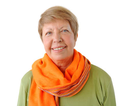 Portrait of elderly woman with orange cravat on the white backgroundの写真素材