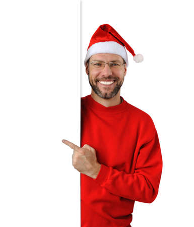 Smiling christmas man wearing a santa hat isolated on the white backgroundの写真素材