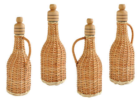Glass wine bottle braided straw isolated on white backgroundの写真素材