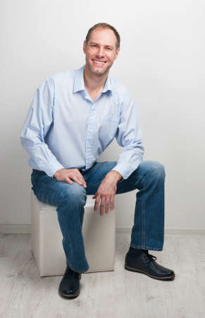 Portrait of  sitting manの写真素材