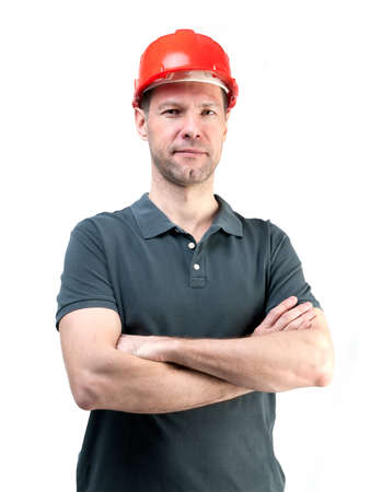 Portret of worker man in red helmet isolated on white backgroundの写真素材