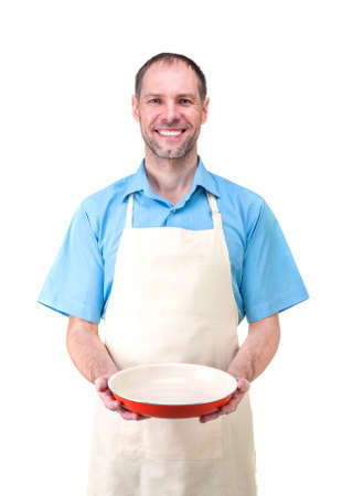Handsome man holding a dish for yourの写真素材