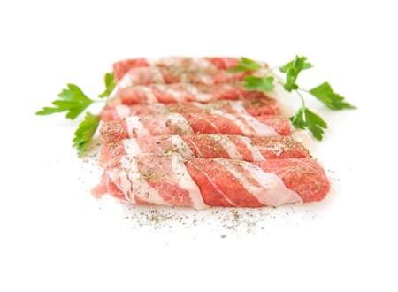 Fresh meat rolls with spices isolated on white backgroundの写真素材