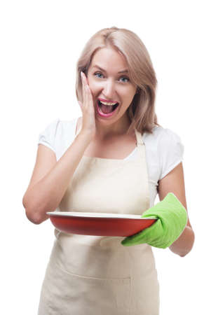 Beautiful woman holding a dish for a delicious mealの写真素材