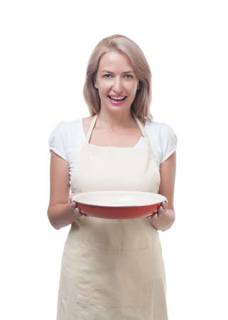 Beautiful woman holding a dish for a delicious mealの写真素材