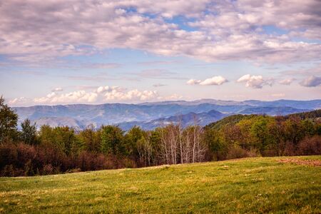 Mountain layers landscape. Springtime in mountain meadow landscape. Meadows and mountains landscape. Blue mountains layers landscape. Beauty in nature. Landscape. Mountains. Valley nature.の写真素材