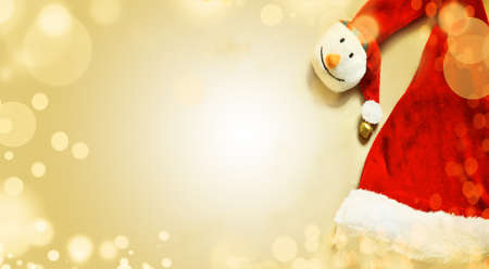 santa hat with gift on wooden table. Top view with copy spaceの写真素材