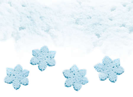 Blue big snowflakes on winter snow background.の写真素材
