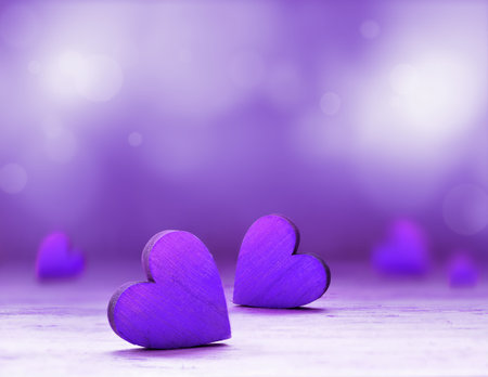 Wooden heart on purple background. Valentines Day.