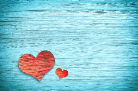 Wooden heart on blue background. Valentines Day.