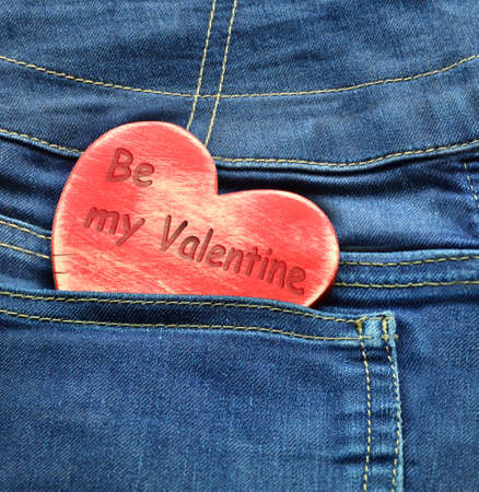 Jeans background with wooden heart. Texture Valentine's day.の写真素材
