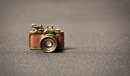 old vintage decorative small camera on a gray background