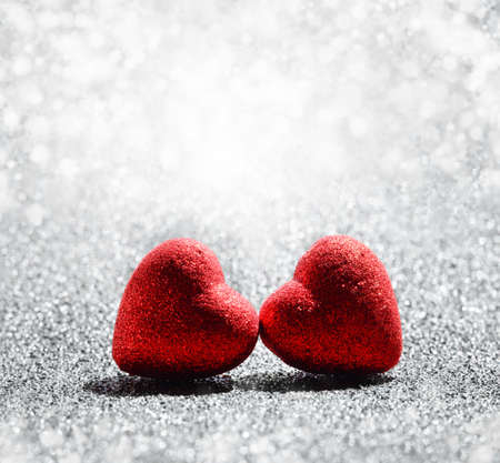 The red Hearts on abstract light glitter background in love concept for valentines dayの写真素材