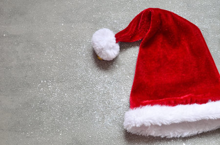 Christmas grey background with Santa hat.Happy new year
