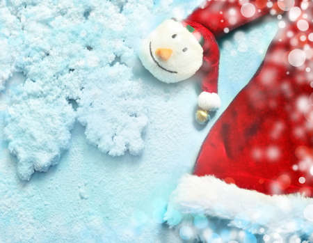 Christmas Santa hat and snowflake on blue background. Christmas or New Year decoration.の写真素材