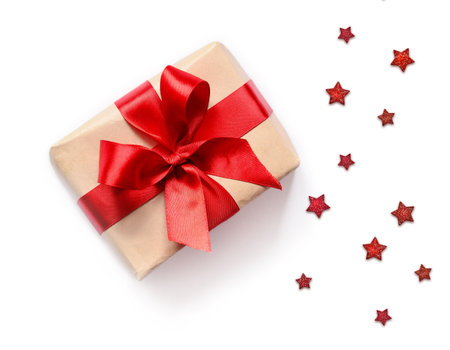 Gift box with red ribbon on white background
