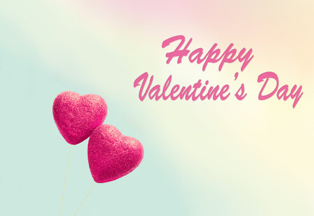 Greeting card for Valentine's Day , with two red hearts on sky background