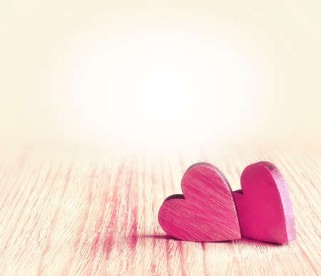 Two red hearts on wooden background. Valentines day.の写真素材