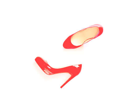 Top view of new pair of red stylish shoes isolated on whiteの写真素材