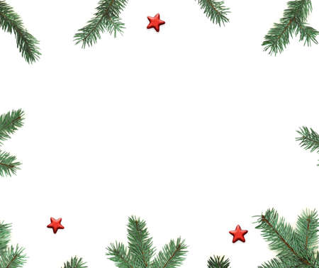 Fir tree branch and star on white background. Top view with copy space.の写真素材