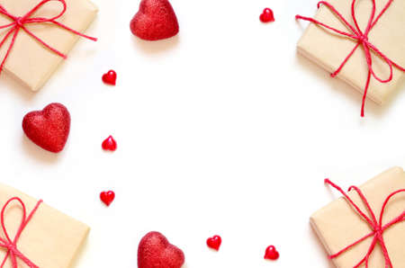 A gift on a white background with box and hearts. The concept of the St. Valentine's day, weddings, engagements, Mother's Day, birthday, New Year, Christmas and other holidays. Flat lay.の写真素材
