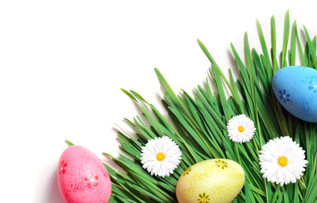 Easter painting eggs with daisy on fresh green grass. Happy Easter.