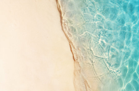 Soft beautiful ocean wave on sandy beach. Summer background.の写真素材