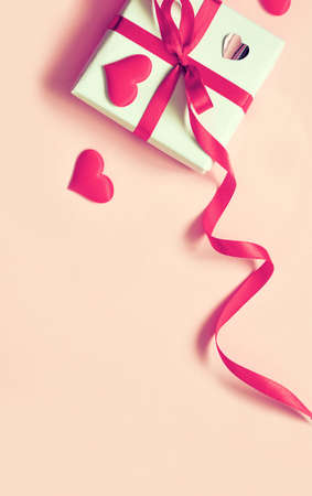 Valentine day composition. White gift box with bow and hearts. Top View. View from above.の写真素材