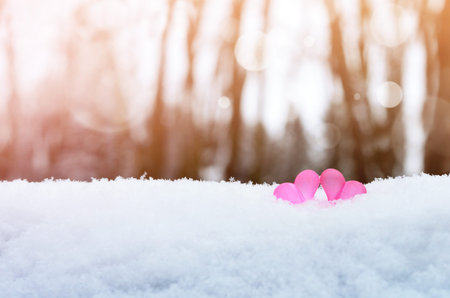 Beautiful romantic vintage red hearts together on white snow winter. Love and St. Valentines Day...