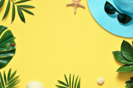 Tropical Background. Palm Trees Branches, hat with starfish and seashell on yellow background....