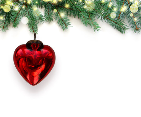 Composition with natural fir branches and red heart. Valentine's day decoration. Greeting card with copy space.の写真素材