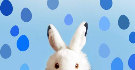funny rabbit on blue background. Easter concept.